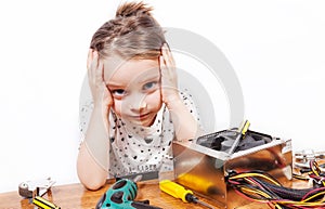 Exasperated girl while repairing PC components photo