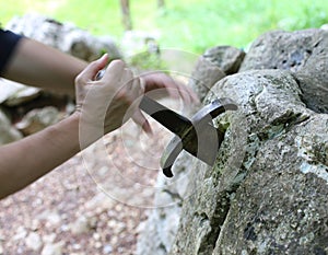 excalibur the famous sword in the stone of king Arthur in the forest photo