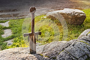 Excalibur, King Arthur's sword in stone. Edged weapons from the legend Pro king Arthur