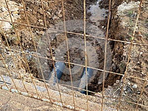 An excavated pit is a ditch for laying cables and wires with pipes under the ground during the construction and repair of houses