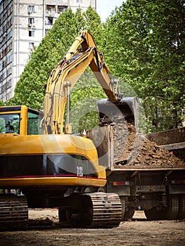 Excavated trench on the road in the city for the reconstruction of the water supply. The work of utilities to improve the