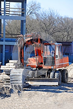 Excavating machine on construction site