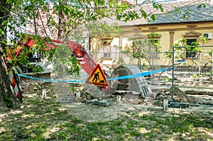 Excavation machinery excavate ground from street in the shade for new district heating pipe line photo