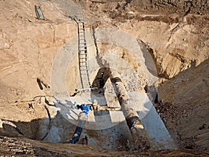 Excavation pit. Old 500mm drink water pipe with 150mm cornering arm with gate valves