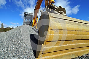 Excavator against blue sky