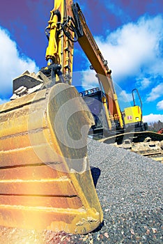 Excavator against blue sky