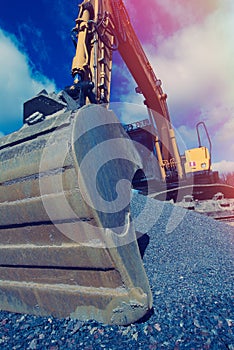 Excavator against blue sky