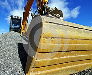 Excavator against blue sky