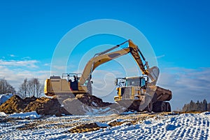 Excavator and Articulated Dump Truck sunny weather