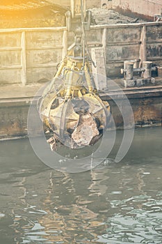 Excavator on barge with hydraulic rotator stone grab 2