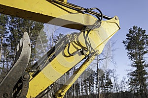 Excavator boom arm elbow and hydraulics tubing