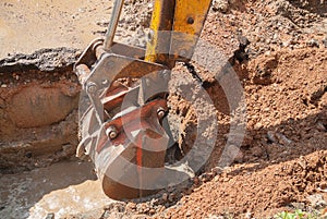 Excavator bucket bulldozer work a hole the repair of pipe