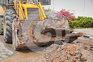 Excavator bucket bulldozer work a hole the repair of pipe
