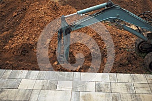 excavator bucket digging a trench