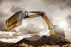 Excavator bucket in dramatic lighting