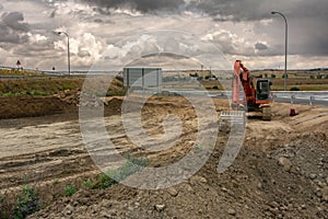 Excavator building a road in a site construction