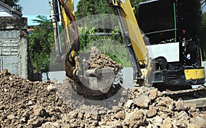 Excavator bulldozer in sandpit digging soil o
