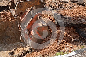 Excavator, bulldozer work a hole the repair of pipe water