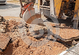 Excavator, bulldozer work a hole the repair of pipe water