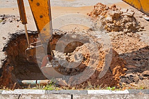 Excavator, bulldozer work a hole the repair of pipe water