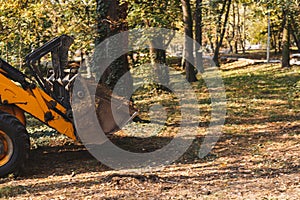 Excavator clearing ground on a building site. Forest road construction