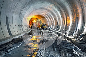 Excavator in construction place of building new railway tunnel. Railway corridor construction with machinery