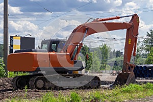 Excavator at a construction site. Excavator loader machine during earthmoving works outdoors at construction site