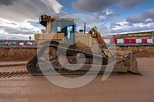 Excavator at a construction site, performing earth moving work