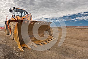 Excavator at a construction site, performing earth moving work