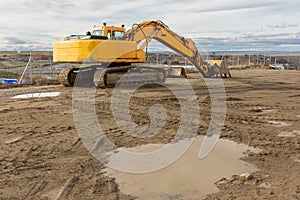 Excavator at a construction site, performing earth moving work