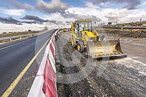 Excavator on the construction works of a highway