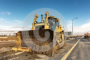 Excavator on the construction works of a road