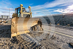 Excavator on the construction works of a road