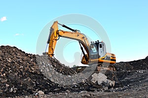 Excavator with crusher bucket for crushing concrete.