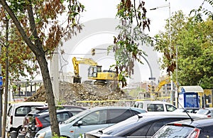 Excavator in the deconstruction works of the ring road of the Plaza de Les Glories Catalanes in Barcelona