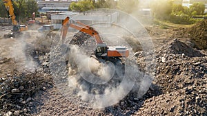 Excavator demolish building. Drone view