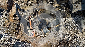 Excavator demolish building. Drone view