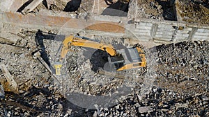 Excavator demolish building. Drone view photo