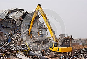 Excavator Demolishing Factory photo