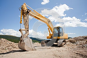 Excavator, digger, earthmover at construction site