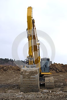 Excavator digger yellow big equipment construction site machine