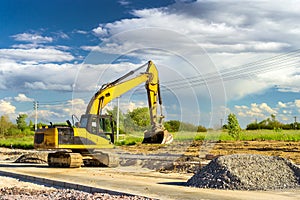 Excavator digging on construction high-speed road