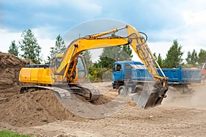 Excavator digging grit