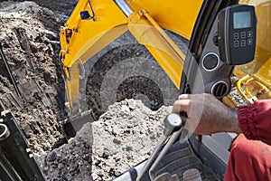 Excavator digging hole ground