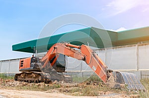 Excavator digging land for adjust in construcktion site