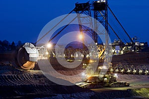 Excavator digging lignite in open-cast mine