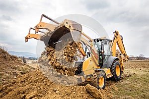 Excavator doing earthworks on site