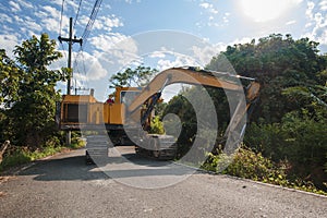 Excavator dredging in small canal