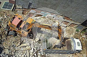 Excavator and dump at new construction site