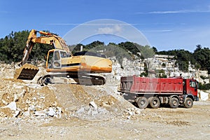 Excavator and dump truck